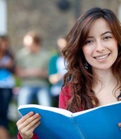 A photograph of a college student who would take a non-cognitive attitudes assessment to help guide their college or university campus.