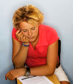 Photo of a college student who appears to be unmotivated. Many students need help with academic or study skills, general coping, or life and stress management to be successful in college.