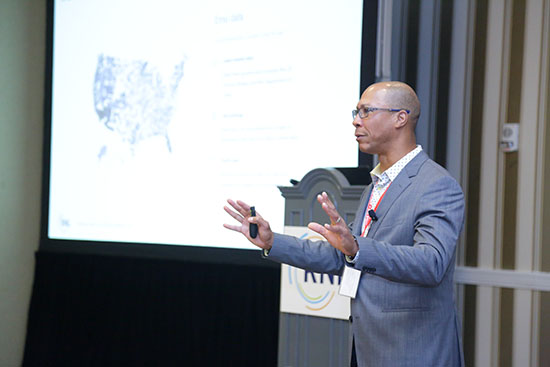 RNL National Conference: Wes Butterfield presenting in front of a data map of the United States