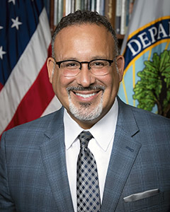Dr. Miguel Cardona