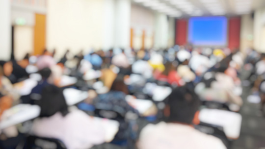 College Enrollment Deposit Blog: image of students at their desks in a college classroom