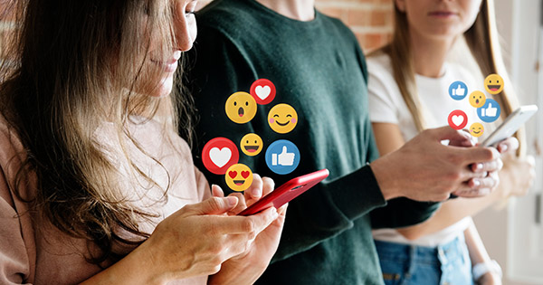 Blog: How Social Media Shapes College Planning For Students. Image of high school students liking content on smartphones.